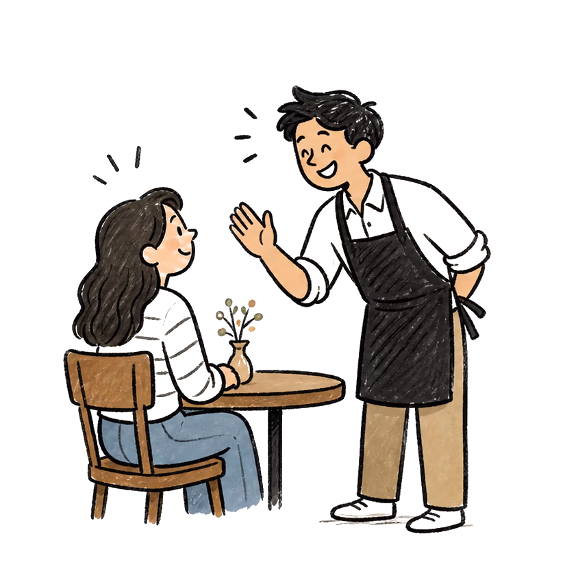 Mesero saludando con calidez a un cliente y haciendo que la visita se sienta personal.